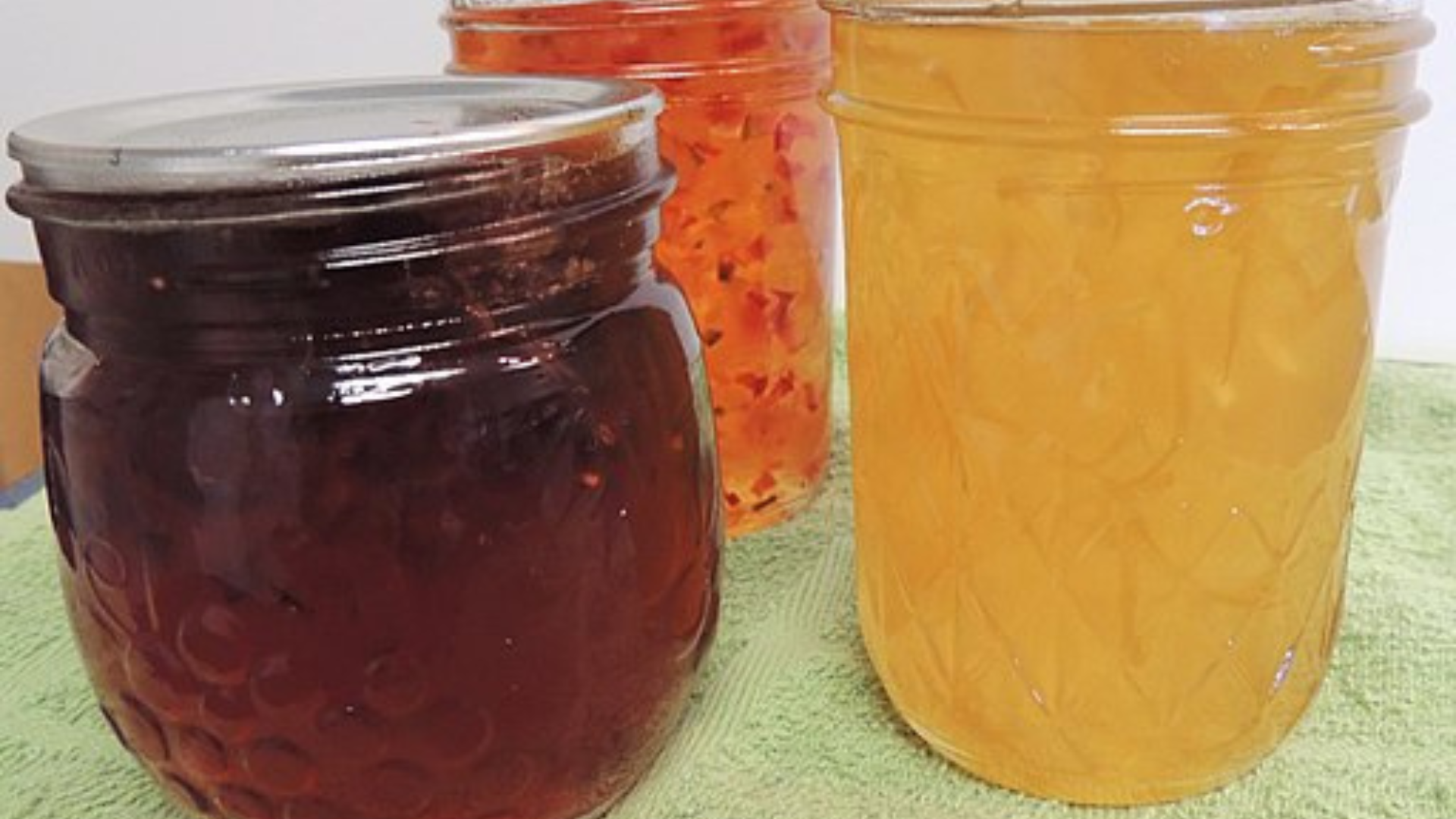 Three jars of preserved foods.